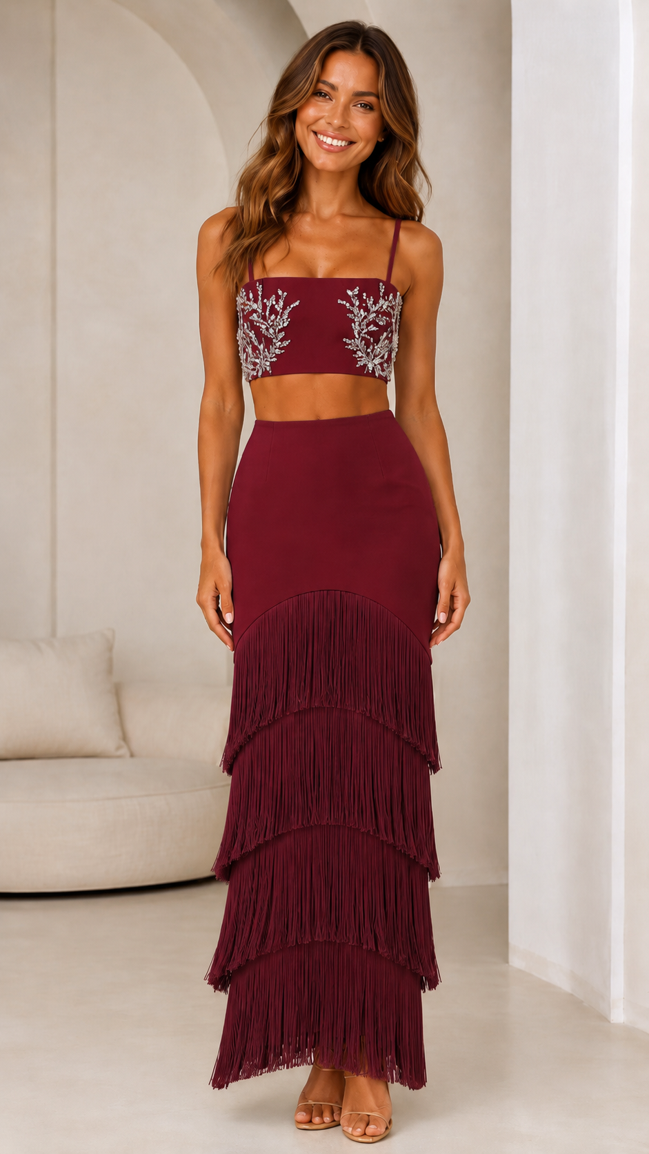 Front view of burgundy embellished crop top and tiered fringe maxi skirt set