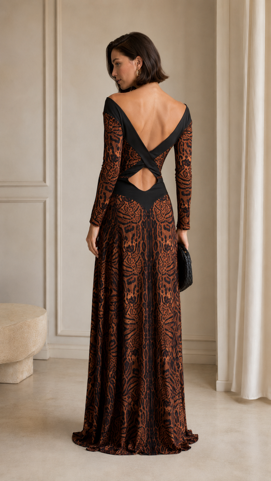 Back view of brown maxi evening dress with open back and crossover strap detail
