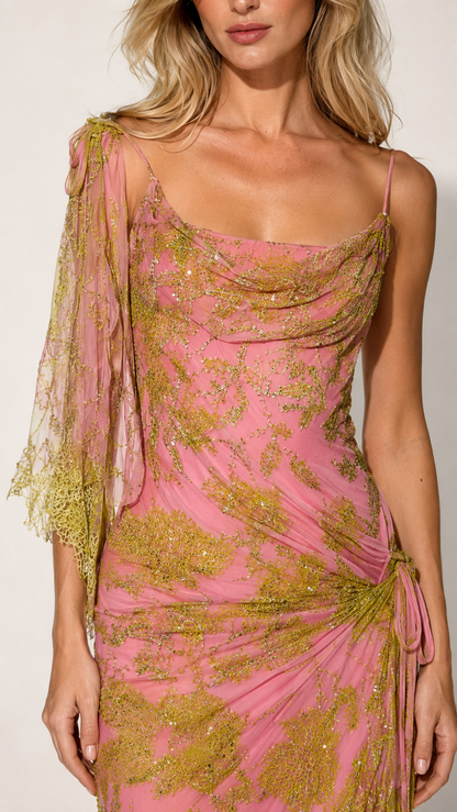 Close-up of pink draped neckline and shimmering floral-pattern mesh overlay with side ruching