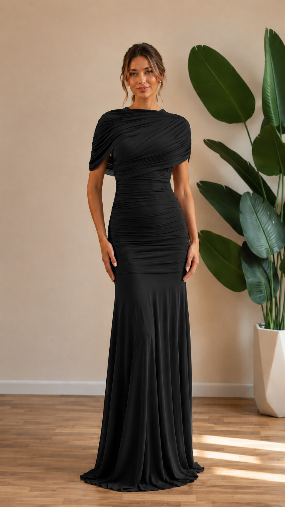 Front view of black ruched mermaid maxi gown