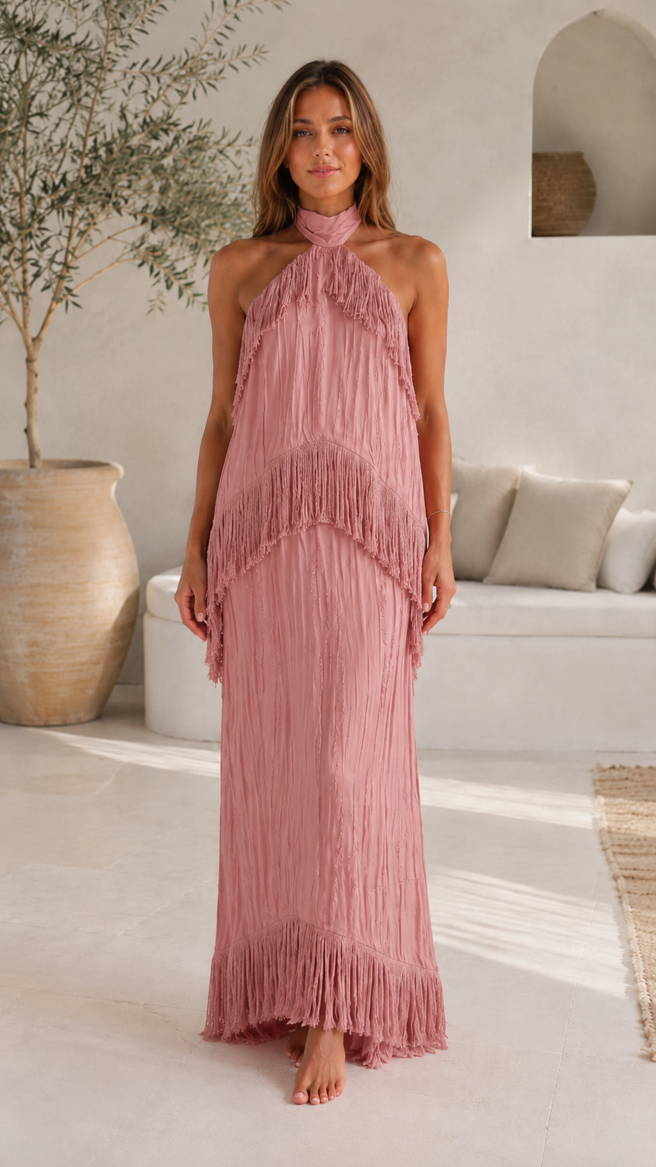 Front view of dusty rose halter fringe maxi dress with textured drape
